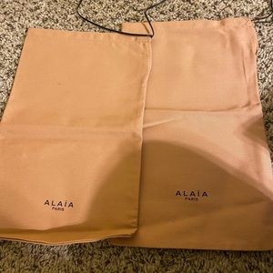 Two Alaia shoe bags